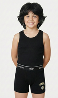 Child wearing a black tank top and black shorts with visible branding on a white background