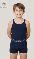 Child wearing navy blue swim outfit with pink trim on a plain background